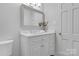 Classic bathroom with decorative mirror, sink, and white cabinets at 629 Wingrave Dr, Charlotte, NC 28270