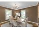 Stylish dining room with modern chandelier, hardwood floors, and natural light at 629 Wingrave Dr, Charlotte, NC 28270