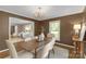 Elegant dining room with modern chandelier, stylish table setting, and warm paint color at 629 Wingrave Dr, Charlotte, NC 28270