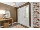 Stylish foyer with hardwood floors, unique wallpaper, and ample natural light at 629 Wingrave Dr, Charlotte, NC 28270