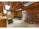 Spacious garage with wooden walls, workbench, cabinets and vintage trunk at 629 Wingrave Dr, Charlotte, NC 28270