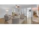 Bright living room with hardwood floors, neutral furniture, and access to the sunroom at 629 Wingrave Dr, Charlotte, NC 28270