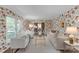 Bright and airy living room with elegant wallpaper, plush seating, and hardwood floors at 629 Wingrave Dr, Charlotte, NC 28270