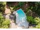 Aerial view of a private backyard pool with well-manicured landscaping and lounge chairs at 629 Wingrave Dr, Charlotte, NC 28270