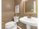 Updated half bath features an antique-style faucet and light fixture and neutral paint at 629 Wingrave Dr, Charlotte, NC 28270