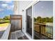 Outdoor balcony with wood railing and siding, offers fresh air and a view of the landscape at 7012 Bryce Ave, Charlotte, NC 28217
