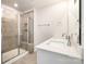 Contemporary bathroom with a glass-enclosed shower and a double vanity with ample counter space at 7012 Bryce Ave, Charlotte, NC 28217