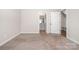 Neutral bedroom with adjoining bathroom and closet, providing ample space and convenience at 7012 Bryce Ave, Charlotte, NC 28217