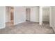 Bedroom with neutral tones and access to bathroom and walk-in closet, creating a private suite at 7012 Bryce Ave, Charlotte, NC 28217