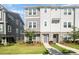 Charming townhome with stone accents, manicured lawn and a welcoming walkway to the front door at 7012 Bryce Ave, Charlotte, NC 28217
