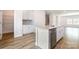Eat-in kitchen with stainless steel dishwasher and ample cabinet storage adjoins a spacious walk-in pantry at 7012 Bryce Ave, Charlotte, NC 28217