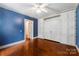 Bedroom with hardwood floors and integrated storage at 805 S Main St, Mount Holly, NC 28120