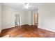 Spacious bedroom with hardwood floors and views into connecting rooms at 805 S Main St, Mount Holly, NC 28120