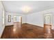 This living room features beautiful hardwood floors and natural light at 805 S Main St, Mount Holly, NC 28120
