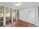 Sunroom with multiple windows and an exterior door at 805 S Main St, Mount Holly, NC 28120