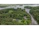 Aerial view of the property surrounded by lush trees and lake access at 8283 Long Island Rd, Catawba, NC 28609