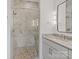 Bathroom features a tiled shower, granite counters, and modern fixtures at 8283 Long Island Rd, Catawba, NC 28609