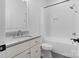 Bathroom features a tiled shower, granite counters, and modern fixtures at 8283 Long Island Rd, Catawba, NC 28609
