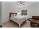 Cozy bedroom with ceiling fan, large window and comfortable bed at 8283 Long Island Rd, Catawba, NC 28609