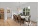 Dining room features a large window, hardwood floors, neutral colors, and a view of the pantry at 8283 Long Island Rd, Catawba, NC 28609