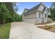 Exterior elevation featuring a three car garage and well-maintained landscaping at 8283 Long Island Rd, Catawba, NC 28609