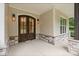 Inviting covered front porch with stone accents, double doors, and stylish lighting at 8283 Long Island Rd, Catawba, NC 28609
