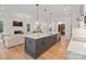 Spacious kitchen features an island with pendant lights, stainless steel appliances, and connects to the living room at 8283 Long Island Rd, Catawba, NC 28609