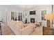 Bright living room features a fireplace, large couch, light wood floors, and sliding doors to the outside at 8283 Long Island Rd, Catawba, NC 28609