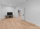 Bright living room with hardwood floors, leading to the stairwell with natural light at 8283 Long Island Rd, Catawba, NC 28609