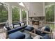 Relaxing screened porch with a fireplace, comfortable seating, and scenic views at 8283 Long Island Rd, Catawba, NC 28609