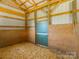 Well-lit horse barn with wood and metal construction, featuring a durable door frame at 830 John Rainey Rd, Salisbury, NC 28147