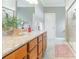 Bathroom showcasing a vanity with granite counters, updated fixtures, and a walk-in shower at 830 John Rainey Rd, Salisbury, NC 28147