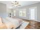 Bright bedroom showcasing natural light, hardwood floors, and neutral wall paint at 830 John Rainey Rd, Salisbury, NC 28147