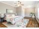 Spacious primary bedroom featuring a ceiling fan, hardwood floors, and natural light at 830 John Rainey Rd, Salisbury, NC 28147