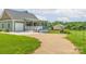 Charming home with a large gravel driveway, attached garage and a view of the barn at 830 John Rainey Rd, Salisbury, NC 28147