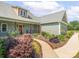 Charming front exterior highlighting the landscaped walkway, covered porch and beautiful curb appeal at 830 John Rainey Rd, Salisbury, NC 28147