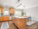 Bright kitchen featuring an island, modern lighting, and a dining area, perfect for casual meals at 830 John Rainey Rd, Salisbury, NC 28147