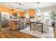 Spacious kitchen with wood cabinets, stainless steel appliances and a dining area with bright, natural light at 830 John Rainey Rd, Salisbury, NC 28147