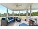 Cozy screened-in porch with comfortable wicker seating, perfect for enjoying the outdoor views at 830 John Rainey Rd, Salisbury, NC 28147