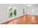 Bright, spacious bedroom with hardwood floors and large windows offering natural light at 833 Lemond Ln, Denver, NC 28037