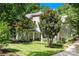 Inviting home with a covered porch, swing, mature trees and a well-maintained lawn at 833 Lemond Ln, Denver, NC 28037
