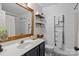 Charming bathroom with white walls, modern sink, decorative mirror, and a bathtub at 8700 Fox Tail Ln, Huntersville, NC 28078