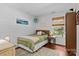 Comfortable bedroom with hardwood floors, natural light, and neutral decor at 8700 Fox Tail Ln, Huntersville, NC 28078
