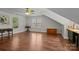 Bright bonus room with hardwood floors, dormer windows, a ceiling fan, and plenty of natural light at 8700 Fox Tail Ln, Huntersville, NC 28078