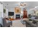 Cozy living room features a fireplace, wood accents, and comfortable seating at 8700 Fox Tail Ln, Huntersville, NC 28078