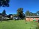 Open backyard with a small shed and plenty of space at 903 Woodside Dr, Kings Mountain, NC 28086