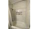 Bright bathroom with a shower and tub combo, featuring modern tile and a built-in niche at 903 Woodside Dr, Kings Mountain, NC 28086