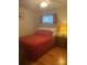 Bedroom with red bedding, hardwood floors and matching lamps at 903 Woodside Dr, Kings Mountain, NC 28086