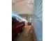 Attached carport featuring blue siding, with a red pickup truck parked underneath at 903 Woodside Dr, Kings Mountain, NC 28086