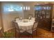 Cozy dining room with hardwood floors, elegant lighting, and traditional wood furniture at 903 Woodside Dr, Kings Mountain, NC 28086